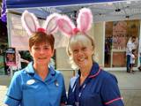 Two female nurses with bunny ears on