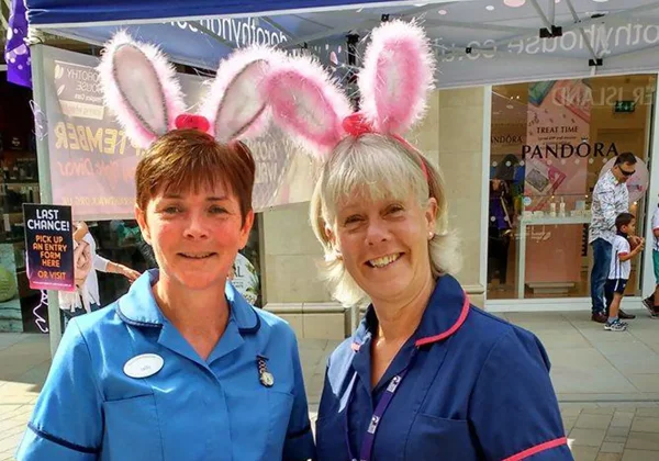 Two female nurses with bunny ears on Two female nurses with bunny ears on