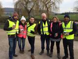 Group of fundraisers in high-vis jackets facing the camera